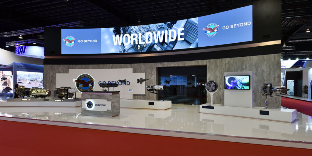 Large curved LED wall as part of a large custom expo stand