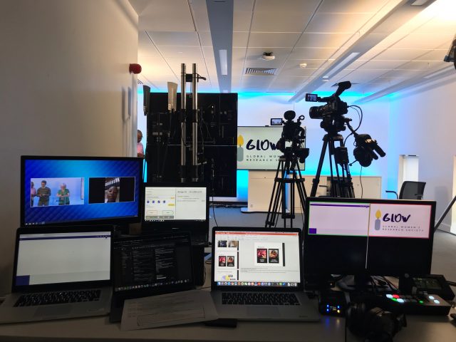 Live steaming equipment set up with laptop cameras and screens